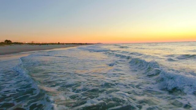 Low flying over ocean waves at sunrise Myrtle beach SC