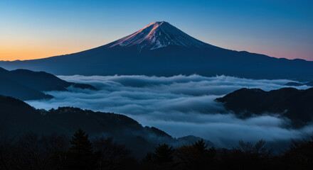 Fototapeta premium Majestic Mount Fuji at Sunrise Above a Sea of Clouds – Iconic Japanese Landscape with Silhouetted Trees