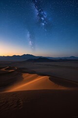 a view of the milky over the desert with sand dunes