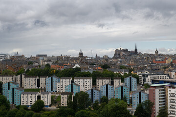 Edinburgh, Scotland city view with a mix of modern and older residential buildings and the famous Edinburgh Castle in the background situated atop Castle Rock.