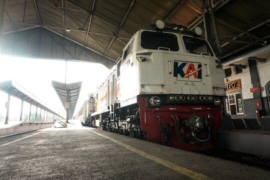 Front Side view of a cement cargo train locomotive of PT Kereta Api Indonesia (KAI) a government owned company that holds railroad operating system in Indonesia