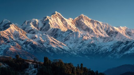 Golden sunlight bathing snow covered annapurna peaks, revealing majestic himalayan landscape during early morning alpine glow