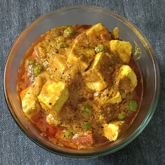 Creamy matar paneer with soft paneer cubes and green peas in rich tomato gravy, served in a clear bowl—perfect with naan or rice!