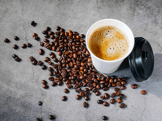 Coffee crema espresso in paper Coffee cup and bean on gray background, Top view of Espresso in  Takeaway paper coffee cup.