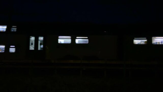 treno in transito di notte, train moving in the night 