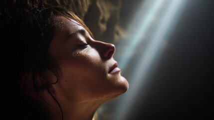 A woman in deep meditation inside a cave, captured in a close-up that highlights serenity, introspection, and the raw connection to nature.