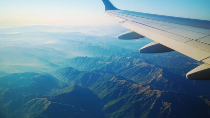 Obraz premium A view from an airplane window with breathtaking scenery.