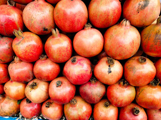 A pile of fresh pomegranate.