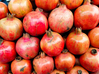 A pile of fresh pomegranate.