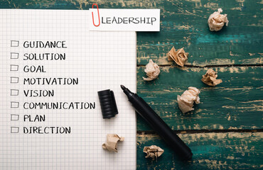 Piece of paper with a list of words and a black marker