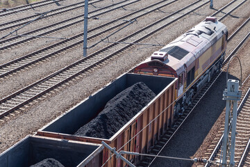 Train loaded with coal. Coal industry. Type of fuel, raw material for industry