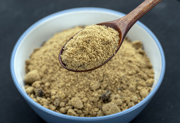 Organic Brown Sugar: A close-up shot captures the rich texture and inviting aroma of organic brown sugar, presented in a rustic bowl and wooden spoon.