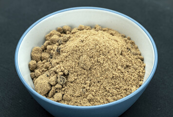 Organic Brown Sugar Bowl: A close-up of a brightly colored brown sugar bowl filled with organic coarse brown sugar, showing the texture and richness of the sugar granules.