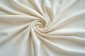 Cream-colored fabric draped in a swirling pattern.