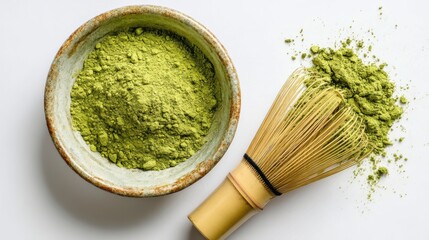Green Matcha Powder in Bowl with Bamboo Whisk on White Background for Culinary Uses