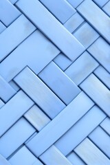 Interwoven light-blue rectangular slats forming a diagonal pattern