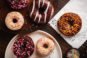 Glazed donuts on wooden background. Top view