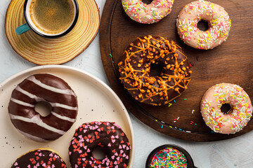 Set of various colorful donuts on white background. Top view.