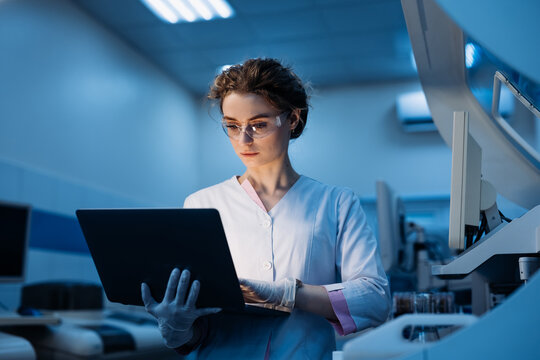 Woman portrait, scientist in lab, chemical engineer and forensics Using Computer. Development Center. Specialist Developing Innovative Medicine For Treating Mental Disorders Or Pain Relief