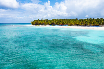 Aerial view on tropical island with palm trees and caribbean sea. Saona Island.