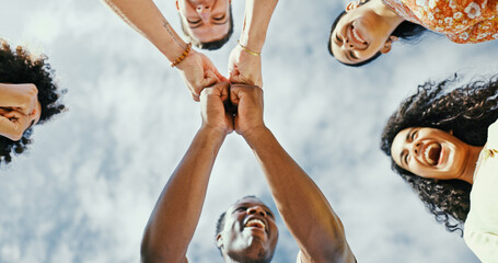Below, fist bump and friends with huddle, vacation and travel with summer holiday. Low angle,...