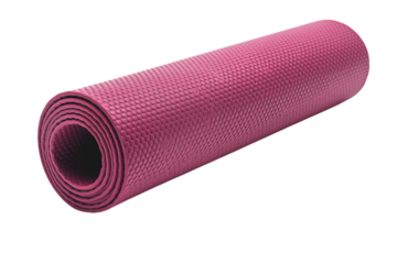A rolled up pink yoga mat with a textured surface is lying on a dark surface in a studio setting png