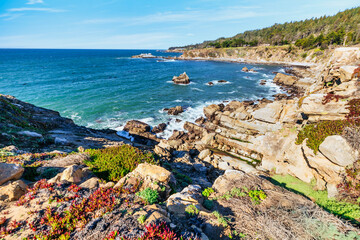 Coastal cliffs along California's Highway 1 in Northern California. Rugged ocean rocks, crashing...