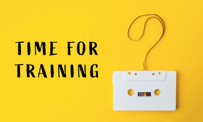 White cassette tape with a yellow background