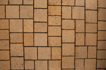 Paving surface. Orange square tiles texture. Stone street road - paving texture effect
