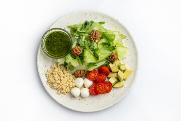 Healthy salad with quinoa, avocado, cherry tomatoes and mozzarella