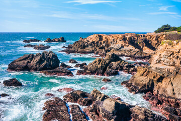 Coastal cliffs along California's Highway 1 in Northern California. Rugged ocean rocks, crashing...