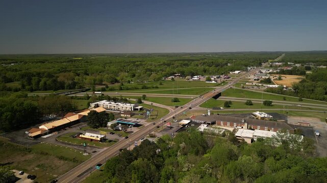 Aerial above Corinthe Mississippi town in spring along highway 72