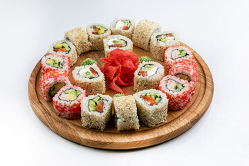 Sushi roll with salmon, avocado and cucumber on white background