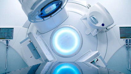 Empty radiotherapy treatment room with linear accelerator ready for use. The clean, modern medical...