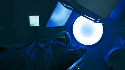 Modern approaches to oncology treatment. A man undergoes radiation therapy for cancer in a modern...