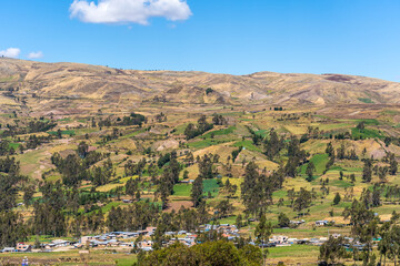 Obraz premium MOUNTAIN RURAL LANDSCAPE WITH PATCHWORK FIELDS AND VILLAGE..