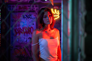 Fototapeta premium Asian young models pose for photoshoots, Women with the brilliant city lights theme