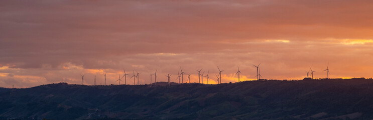 Find the support type and plan that works best for your needs, wind turbines on a green field with clouds and blue sky and a mountain range in the distance, north of waterton- alberta
