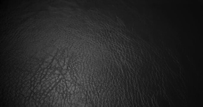 Dark Leather Glide with Sophisticated Motion. Video featuring a refined black leather texture in smooth motion, perfect for upscale design projects.

