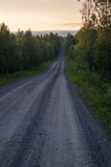Lone gravel road in the taiga in Finland