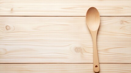 Wooden Spoon on Light Wood Tabletop on wooden background