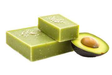 A close up of two green bars with salt and an avocado half on a black background studio shot