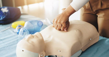 Hands, person and dummy for cpr training with demonstration, compression and breathing safety....