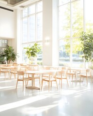 Sunlit minimalist dining area with light wood tables and chairs, positioned near expansive windows showcasing greenery