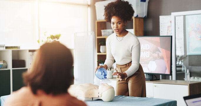 Teaching, cpr and woman with mask, dummy and lesson to help in emergency, healthcare and demonstration. Course, people and instructor with ventilator for mannequin, breathing and oxygen in class - Powered by Adobe