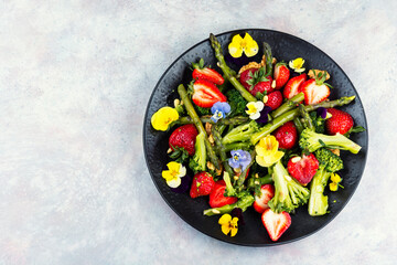 Vegetable salad with strawberries.