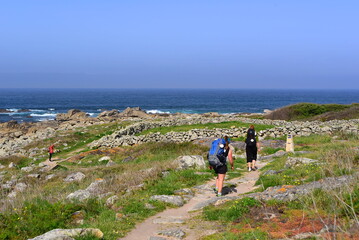 Three young women pilgrims of Compostela on the Portuguese Camino de Santiago