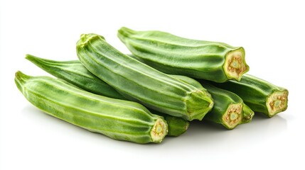 Fototapeta premium Fresh green okra pods stacked on white background
