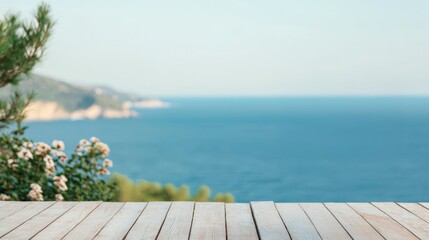 Fototapeta premium Wooden terrace table overlooking tranquil ocean view in summer