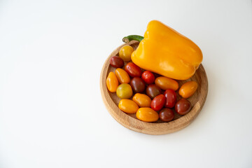 Bright culinary ingredients, vegetables are laid out on the table near the wooden cutting board....